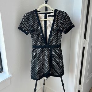 Missguided black & tan skort romper with a deep v neck